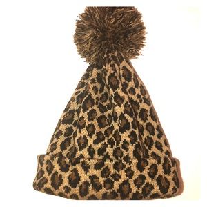 It’s a leopard beanie with a puff.